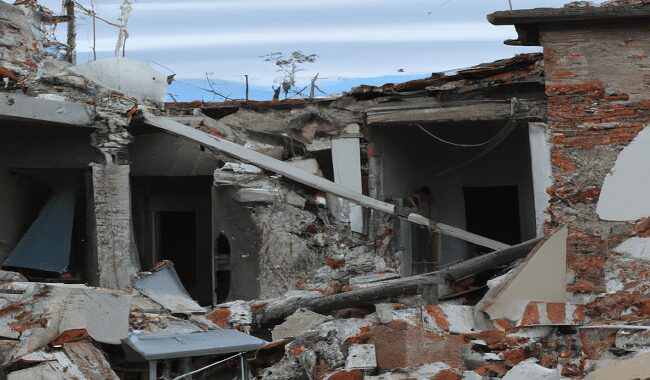 C:\Users\Roghayeh\Desktop\DALL·E 2023-02-23 20.16.41 - Tell Dal E to make me a real photo of the earthquake where the buildings are destroyed.png